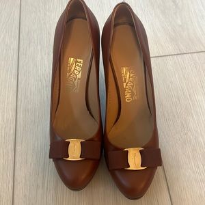 Brown and gold Ferragamo platforms